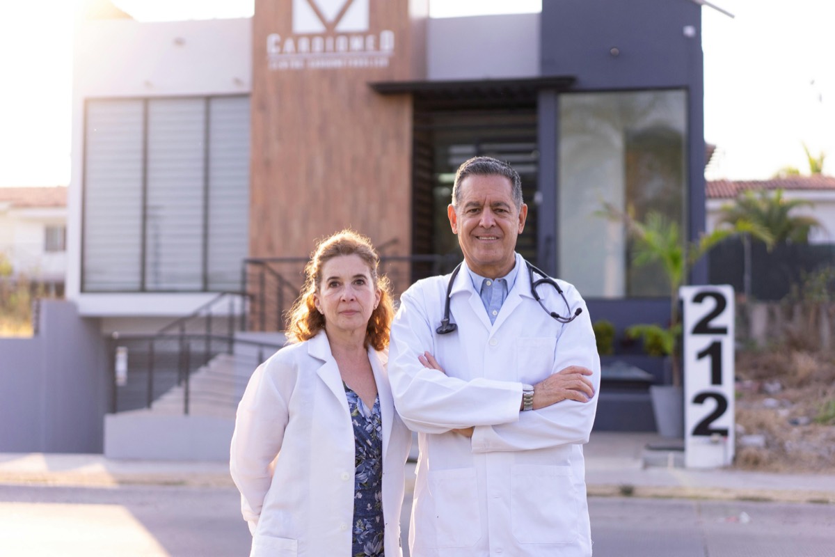 Two physicians outside a clinic